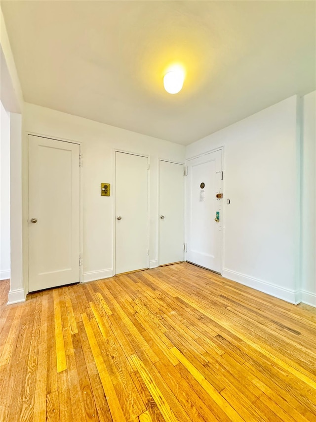 spare room with light hardwood / wood-style floors