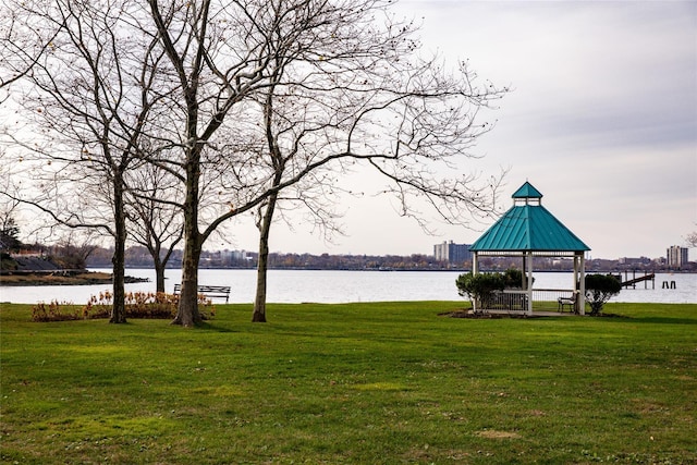 view of home's community featuring a gazebo, a water view, and a lawn