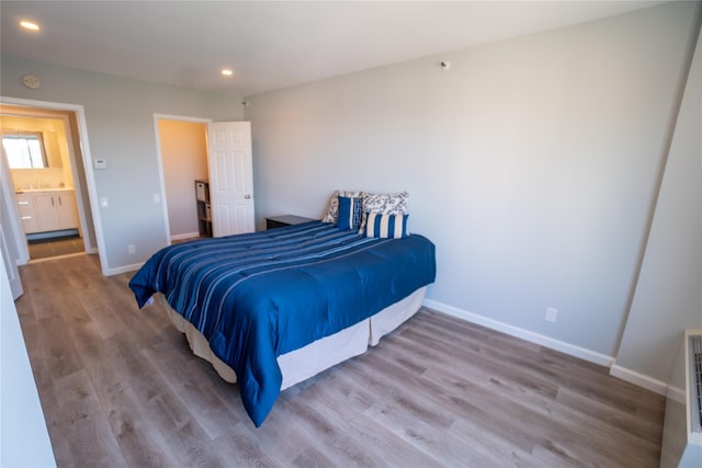 bedroom with hardwood / wood-style floors