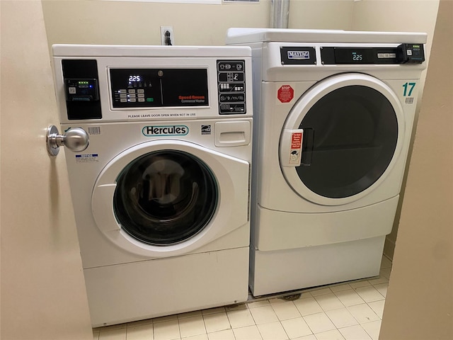 laundry area with washing machine and clothes dryer