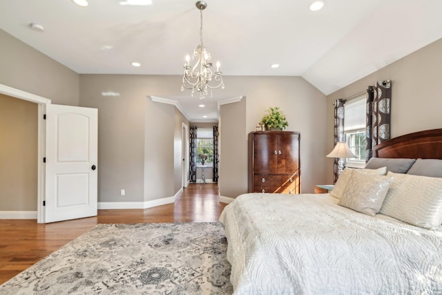 bedroom featuring vaulted ceiling, recessed lighting, wood finished floors, and baseboards