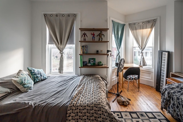 bedroom with hardwood / wood-style floors