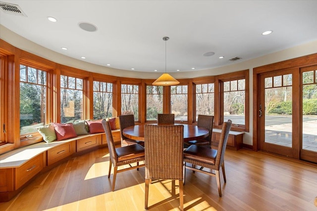 dining space featuring plenty of natural light and light hardwood / wood-style floors