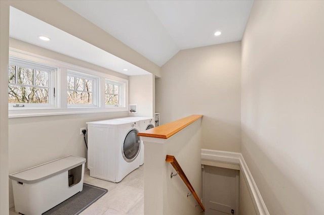 laundry room featuring washer / dryer and light tile patterned floors