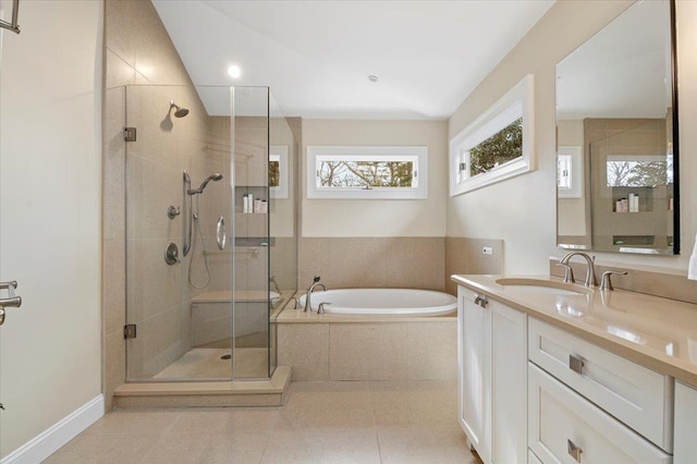 bathroom with separate shower and tub, vanity, and tile patterned floors