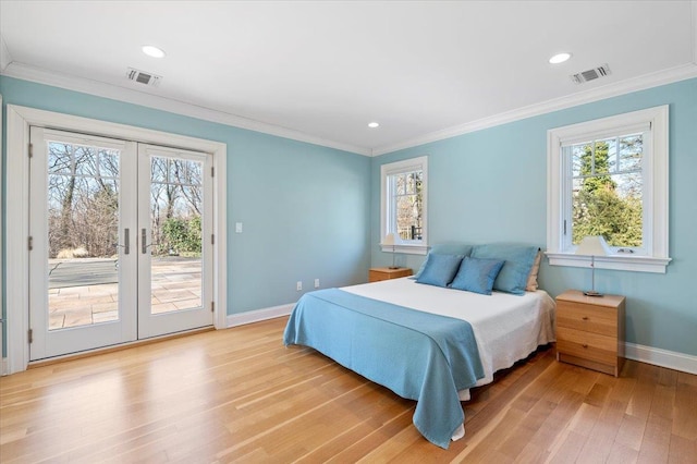 bedroom with multiple windows, access to outside, and ornamental molding