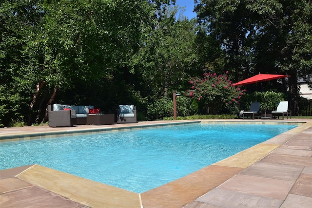 view of swimming pool featuring an outdoor hangout area and a patio