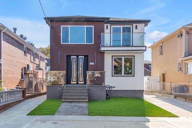 view of front of house with a balcony