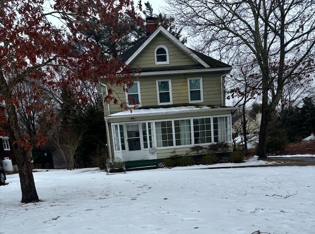 view of property featuring a sunroom