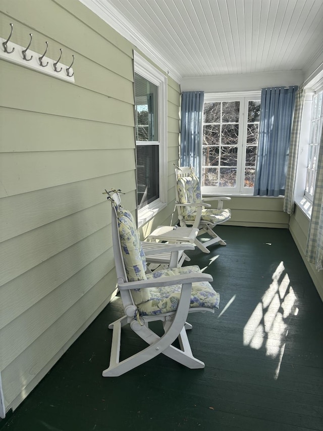 sunroom / solarium featuring wood ceiling