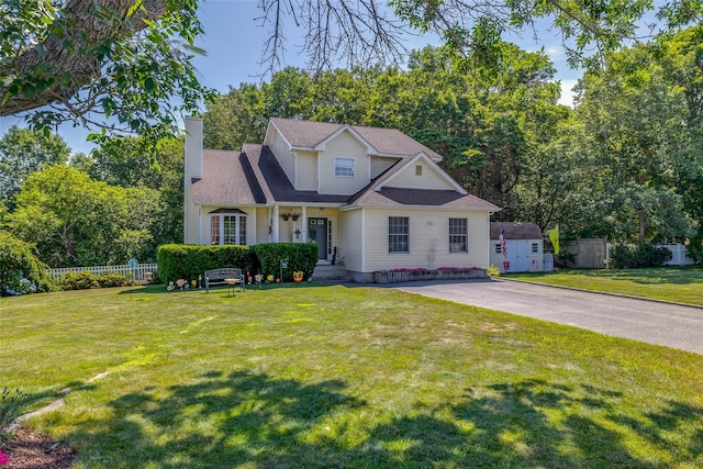 106 Williams Way S, Baiting Hollow, NY 11933 - traditional-style house with a chimney and a storage shed