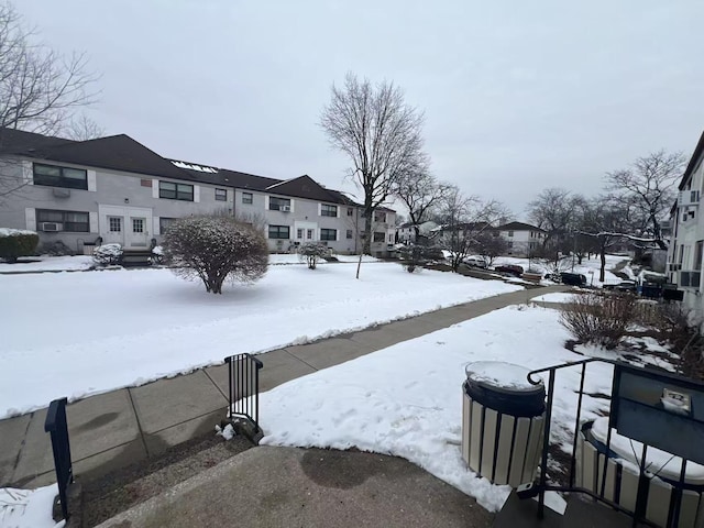 view of yard layered in snow