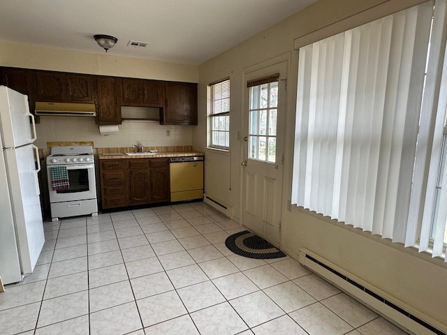 kitchen featuring white appliances, a baseboard heating unit, ventilation hood, and a sink