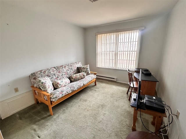 sitting room with carpet and a baseboard heating unit