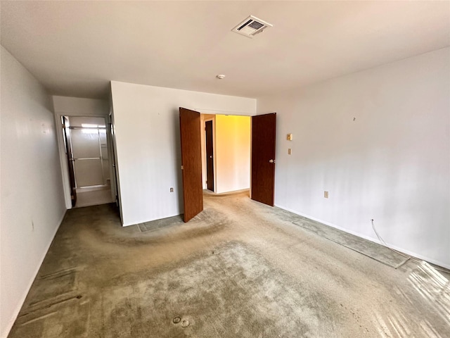 unfurnished bedroom with carpet and visible vents