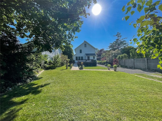 view of yard featuring a wooden deck