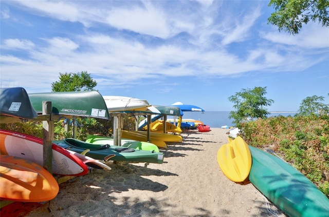 view of playground with a water view