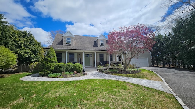 2 Bridle Path, Westhampton Beach, NY 11978 - cape cod home featuring a porch, driveway, a front lawn, and a garage