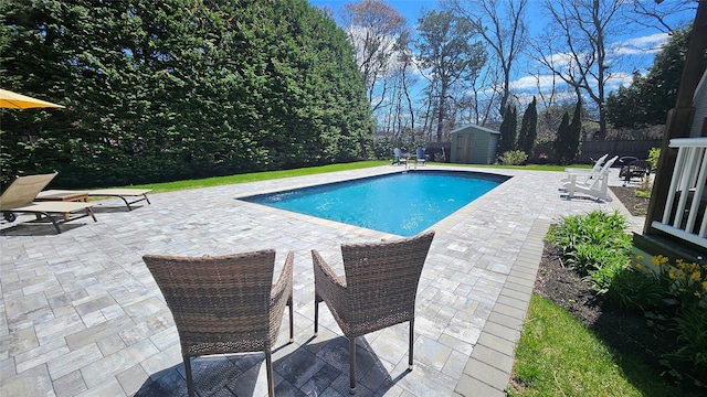 2 Bridle Path, Westhampton Beach, NY 11978 - view of pool with a patio, an outdoor structure, a fenced in pool, a storage unit, and fence