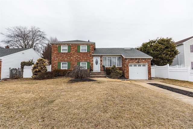 tri-level home with a garage and a front lawn