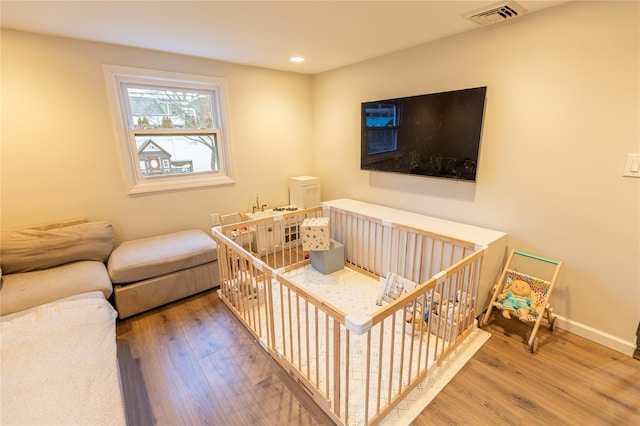 bedroom featuring wood-type flooring