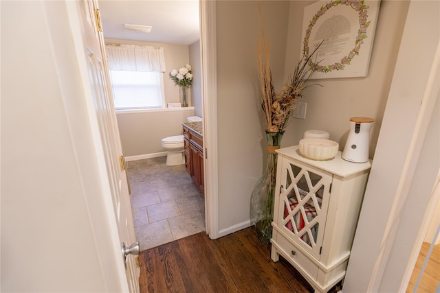 hallway featuring dark wood-type flooring