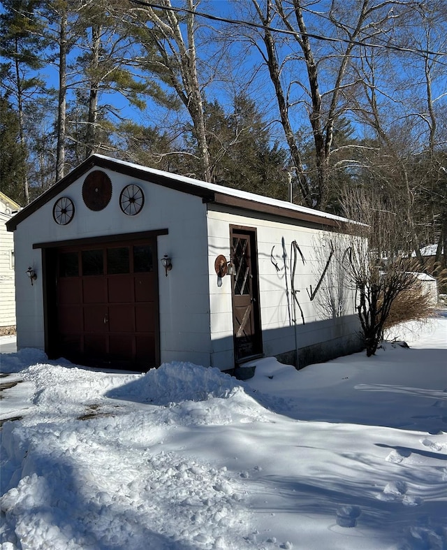 view of snow covered garage