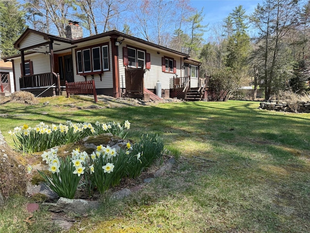 49 Park Rd, Barryville, NY 12792 - view of front of home featuring a front lawn and a chimney