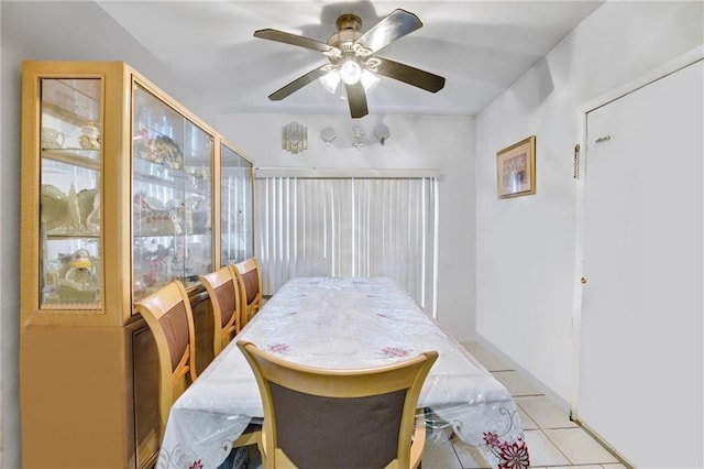 dining room featuring light tile patterned floors and ceiling fan