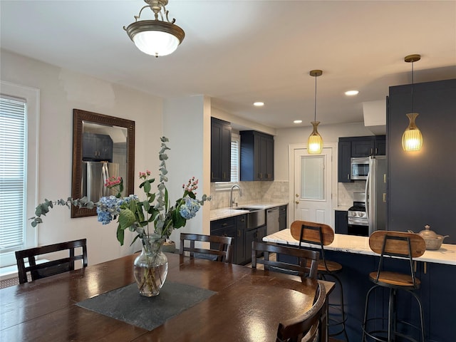 dining area featuring recessed lighting