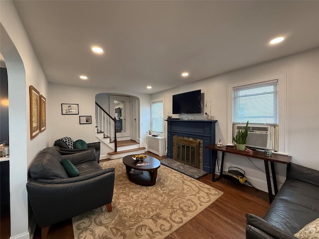 204 N Grove St, Valley Stream, NY 11580 - living area with arched walkways, cooling unit, wood finished floors, recessed lighting, and stairway