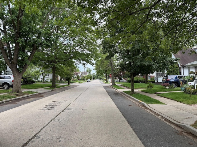 204 N Grove St, Valley Stream, NY 11580 - view of concrete road with sidewalks, curbs, and a residential view