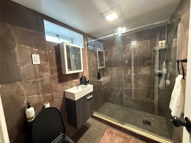 204 N Grove St, Valley Stream, NY 11580 - full bath featuring tile walls, a shower stall, vanity, tile patterned floors, and toilet