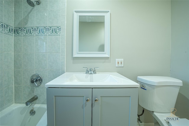 full bathroom featuring vanity, tiled shower / bath combo, and toilet