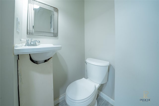 bathroom with toilet and sink