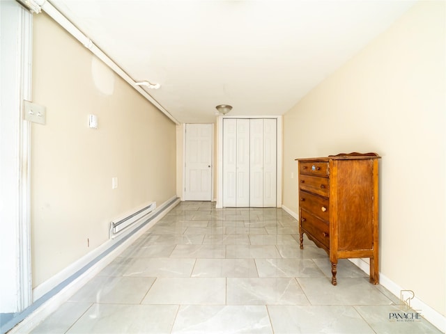 interior space featuring a baseboard heating unit