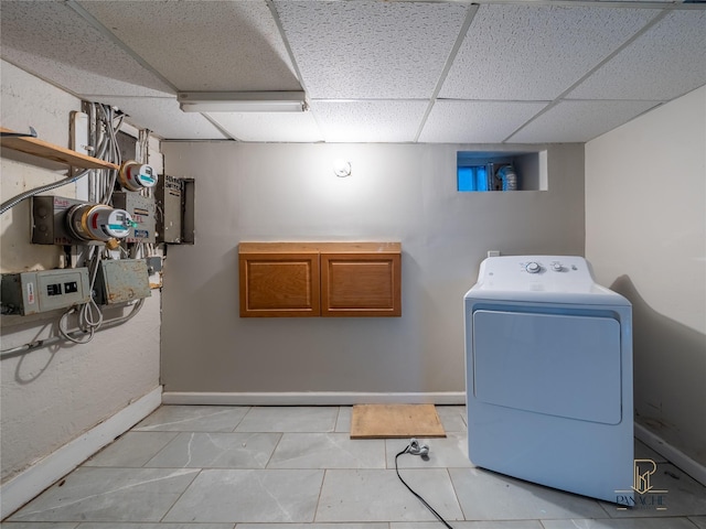 laundry area featuring tile patterned flooring and washer / dryer