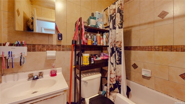 full bathroom with toilet, shower / tub combo, tile walls, vanity, and backsplash