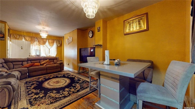 living room featuring hardwood / wood-style flooring and a chandelier