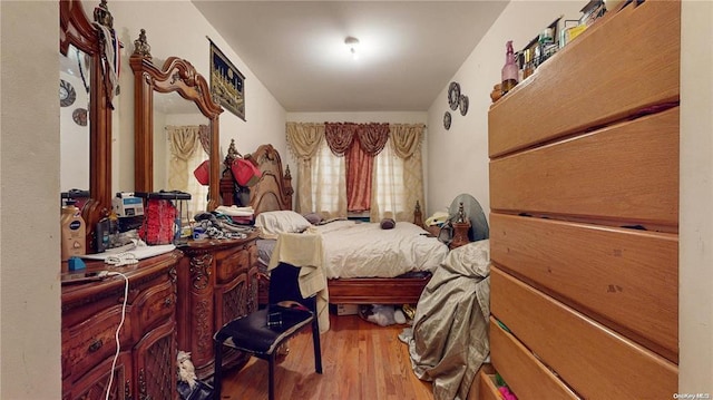 bedroom with wood-type flooring