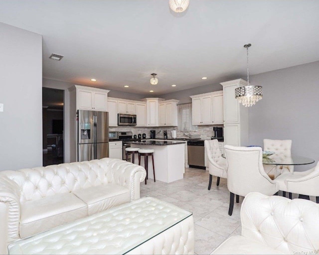 living room with an inviting chandelier