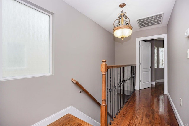 hall with dark hardwood / wood-style floors