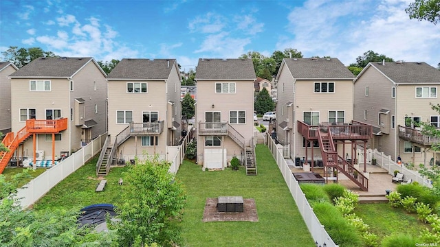 exterior space featuring a deck and a lawn