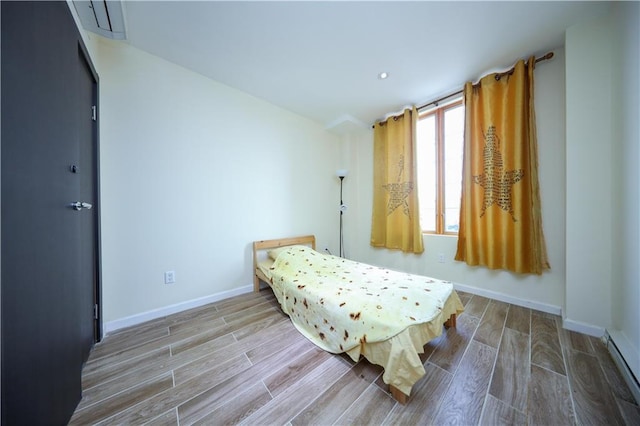 bedroom with a baseboard radiator