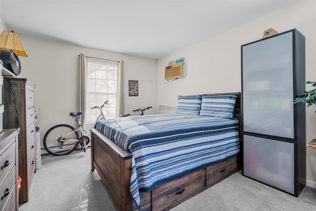 bedroom featuring light colored carpet and a wall unit AC