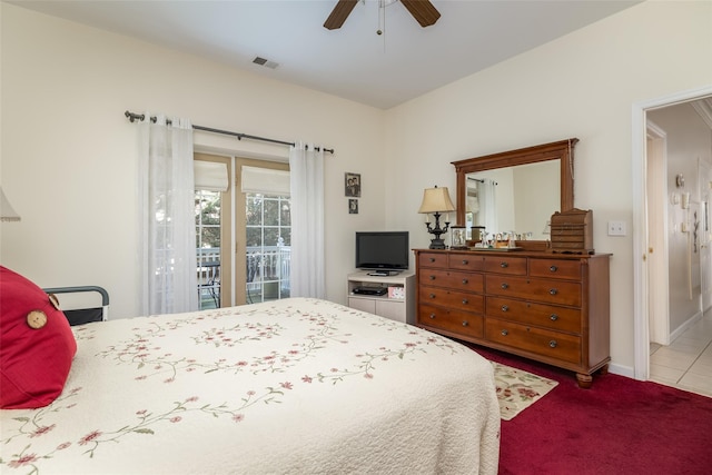 bedroom with visible vents, light colored carpet, ceiling fan, access to outside, and light tile patterned flooring