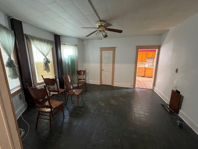 living area featuring ceiling fan