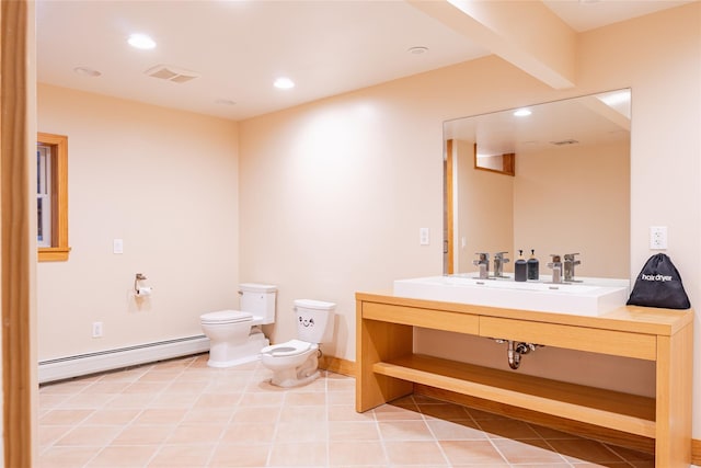 bathroom featuring a bidet, vanity, toilet, tile patterned floors, and baseboard heating