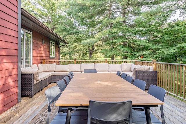 wooden terrace featuring an outdoor living space