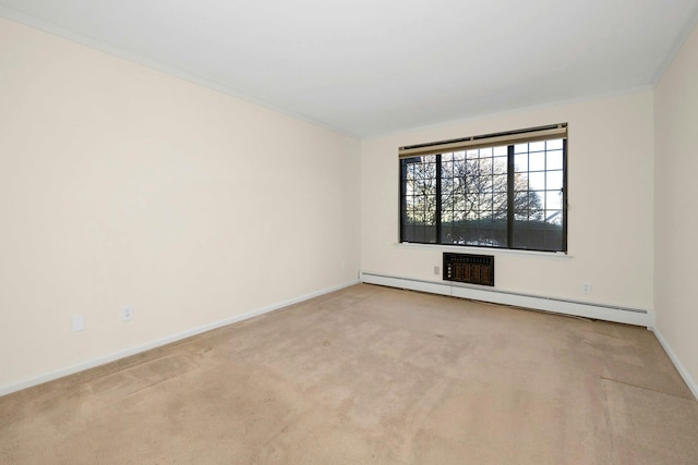 carpeted empty room featuring crown molding and baseboard heating